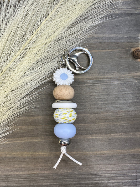 Blue daisy yellow bloom keychain